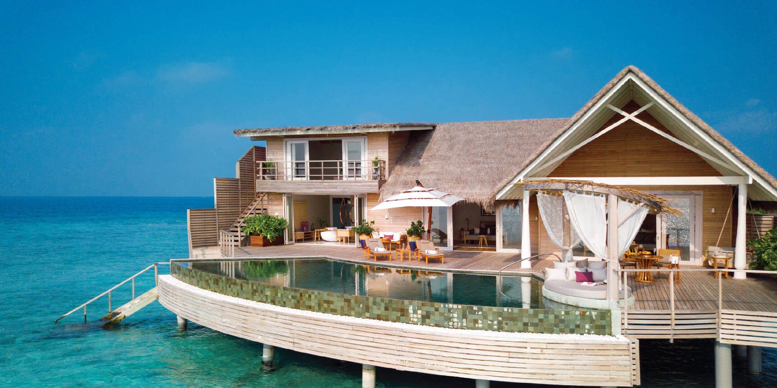 Family enjoying Maldives family holiday packages overwater villa